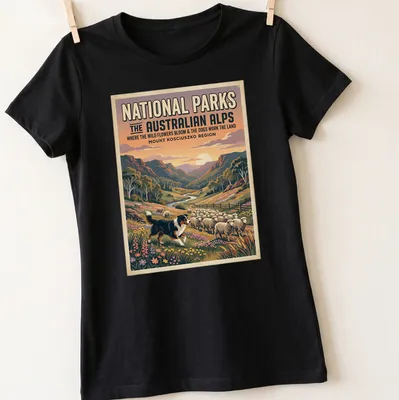 Vintage poster-style shirt featuring a landscape of wildflowers and sheep in the Australian Alps — printed on a women's shirt