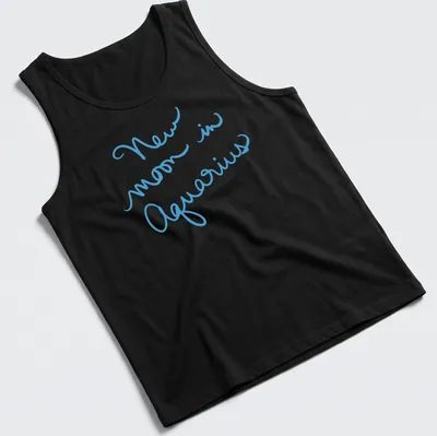Handwritten script of New Moon in Aquarius on a light blue — printed on a tank top
