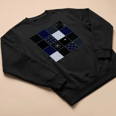 Modern geometric patchwork pattern tee inspired by the night sky in navy and light blue. — printed on a unisex sweatshirt