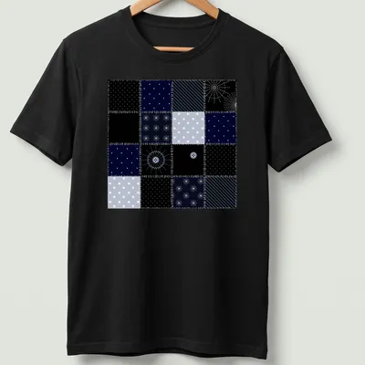 Modern geometric patchwork pattern tee inspired by the night sky in navy and light blue.