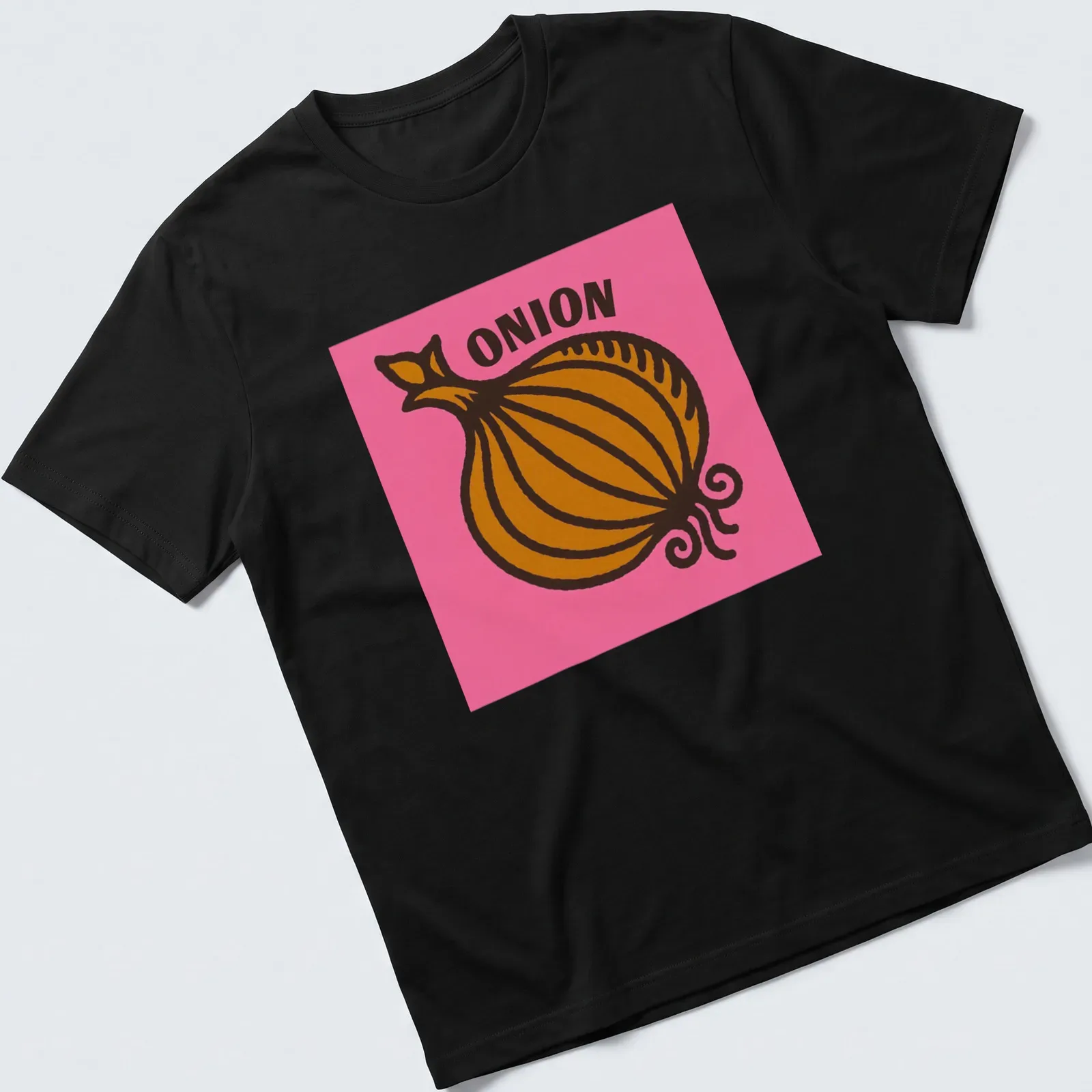 Bold Pop Art t-shirt featuring an 'ONION' graphic on a pink background — printed on a unisex t-shirt