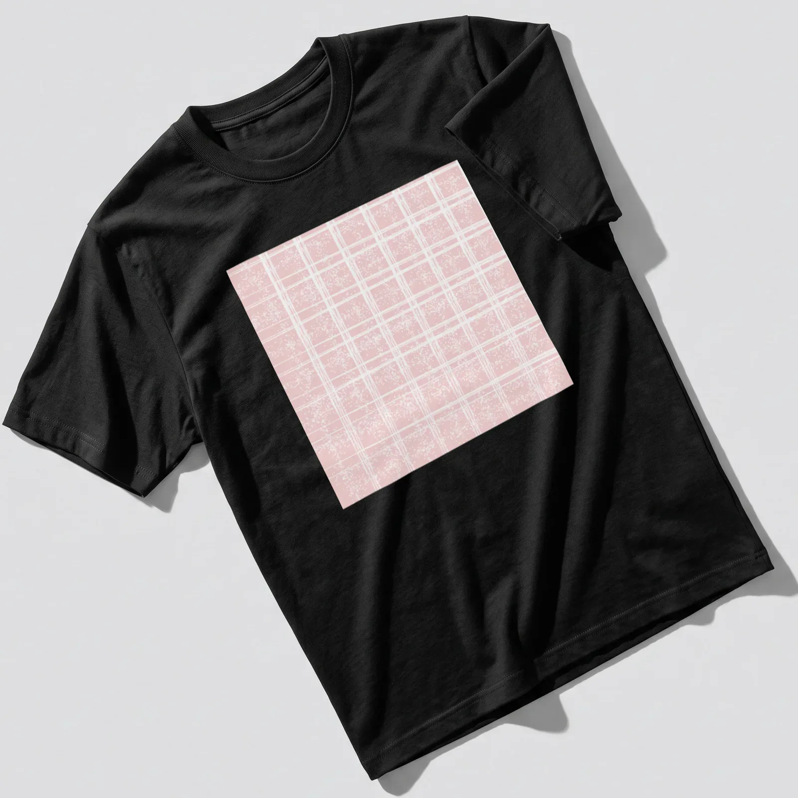 A pastel pink plaid pattern with glittery dots for a stylish look. — printed on a unisex t-shirt