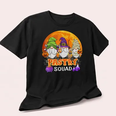 Cartoonish Halloween gnomes with Pastry Squad text in various colors — printed on a unisex t-shirt (angled view)