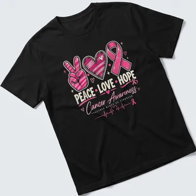 Colorful hand-drawn Cancer Awareness tee with peace sign, heart, and pink ribbon