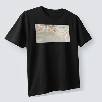 Illustration of a pearl necklace resembling a waterfall in soft colors. — printed on a unisex t-shirt (angled view)