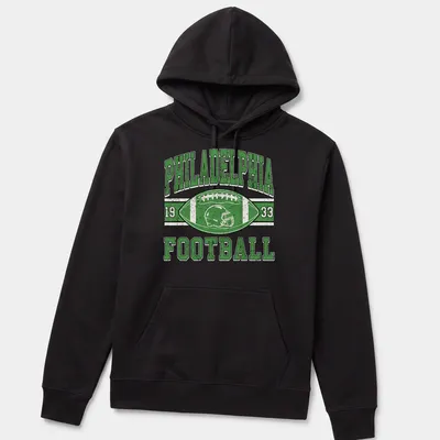 Vintage distressed Philadelphia Football 1933 T-shirt with football helmet and ball graphic — printed on a unisex hoodie