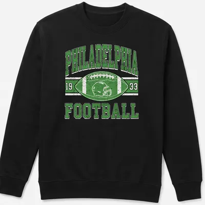 Vintage distressed Philadelphia Football 1933 T-shirt with football helmet and ball graphic — printed on a unisex sweatshirt