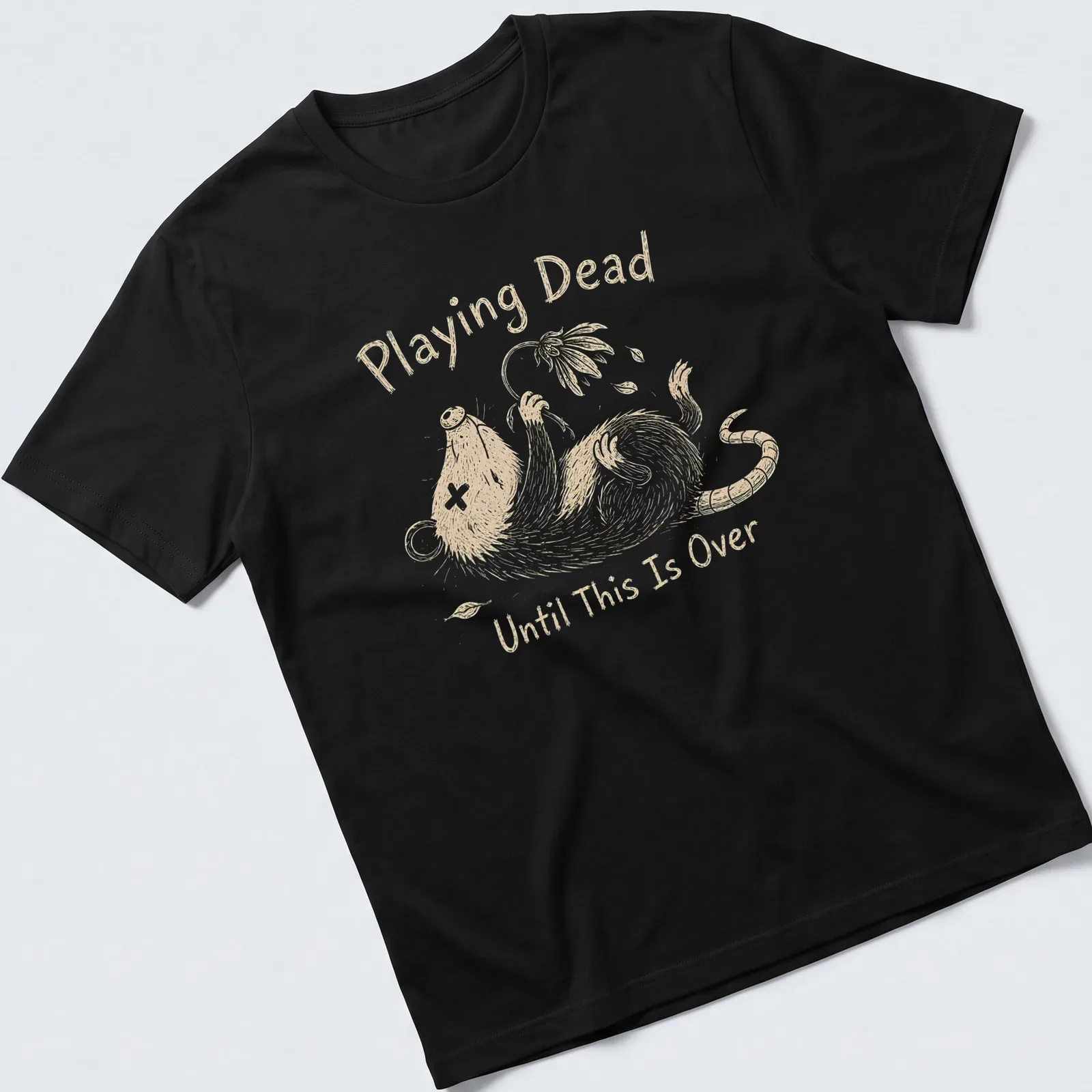 Whimsical illustration of an opossum with the text 'Playing Dead Until This Is Over' in soft colors — printed on a unisex t-shirt