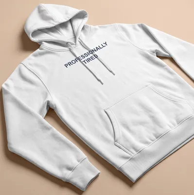 Sarcastic t-shirt with the text 'PROFESSIONALLY TIRED' in bold letters — printed on a unisex hoodie