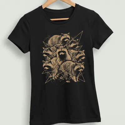 Grunge style T-shirt featuring distressed raccoon artwork in gold, white, and black. — printed on a women's shirt