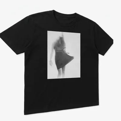 Soft focus monochrome T-shirt featuring a female figure in motion and expressive text — printed on a unisex t-shirt (angled view)