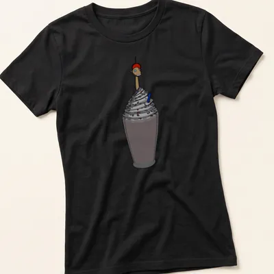 Cartoon graphic of a smiling milkshake character with colorful straw and fun text — printed on a women's shirt