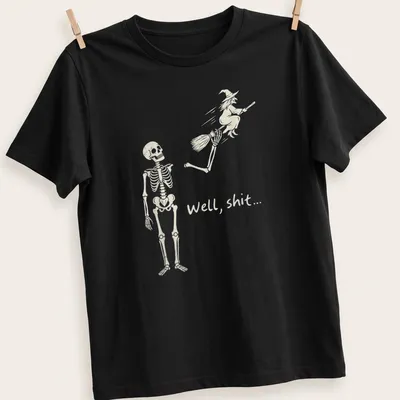 A humorous line-art print of a skeleton reacting to a flying witch with the text 'Well, shit...'