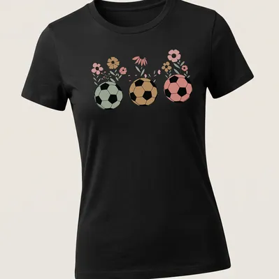 Retro floral design featuring soccer balls and wildflowers in various colors. — printed on a women's shirt