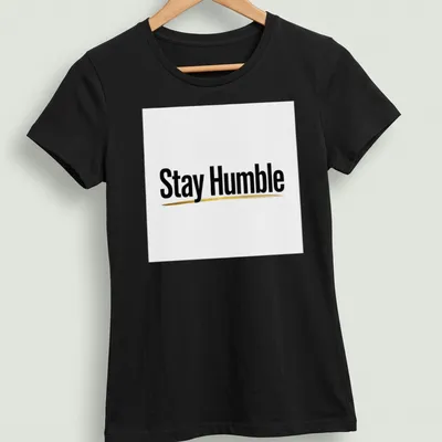 Minimalist Stay Humble t-shirt with black and gold typography — printed on a women's shirt