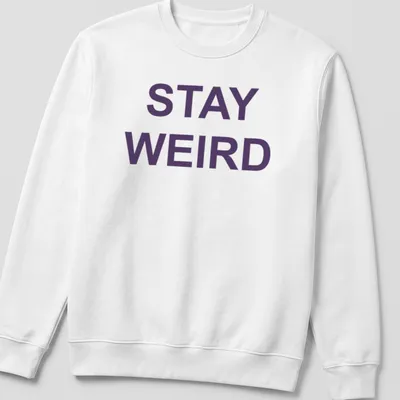 Purple t-shirt with the quote 'Stay Weird' in a playful font — printed on a unisex sweatshirt