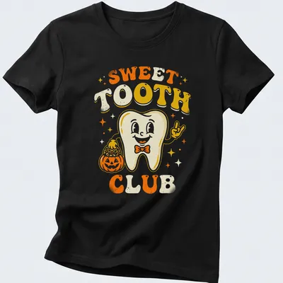 Retro cheerful Halloween T-shirt with a smiling tooth character beside a pumpkin — printed on a women's shirt