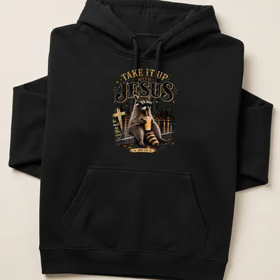 Vintage raccoon t-shirt with text and illustration in retro colors — printed on a unisex hoodie