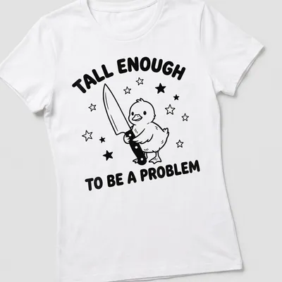 Cartoon duck graphic with humorous text about height in black and white — printed on a women's shirt