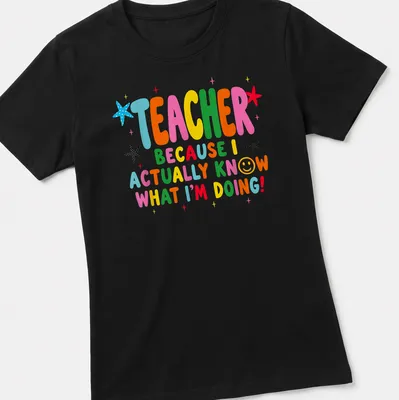 Colorful teacher-themed t-shirt with playful text and stars — printed on a women's shirt
