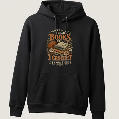 Vintage illustration tee featuring books and crochet imagery with warm tones — printed on a unisex hoodie
