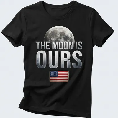 Graphic t-shirt featuring the phrase 'The Moon Is Ours' with a moon and American flag — printed on a women's shirt