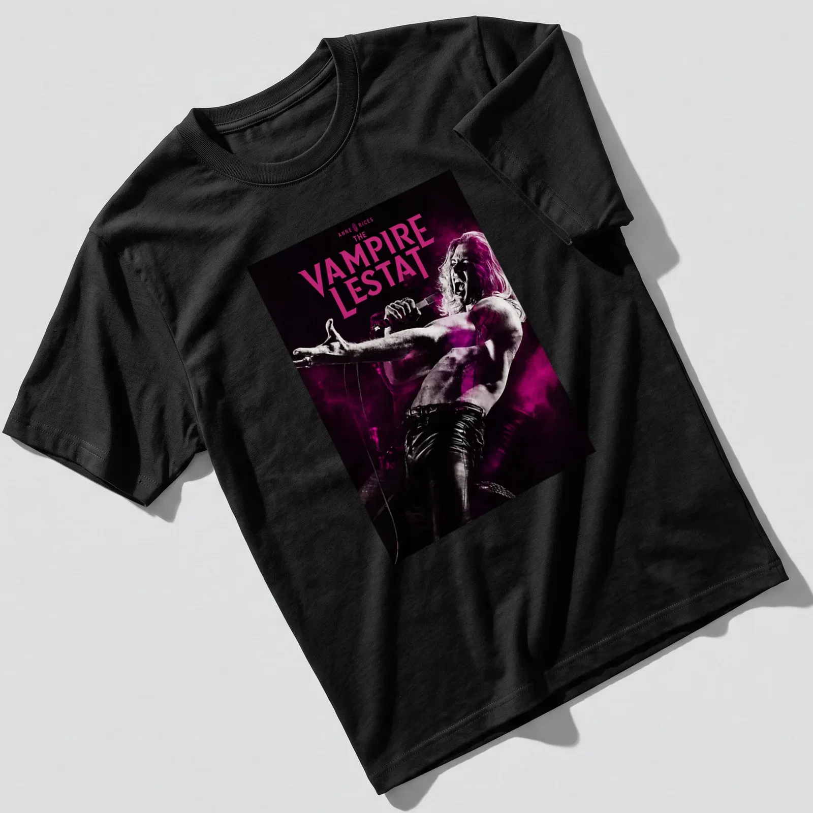 Gothic Vampire Lestat shirt with bold lettering and vampire imagery in black, pink, and white. — printed on a unisex t-shirt