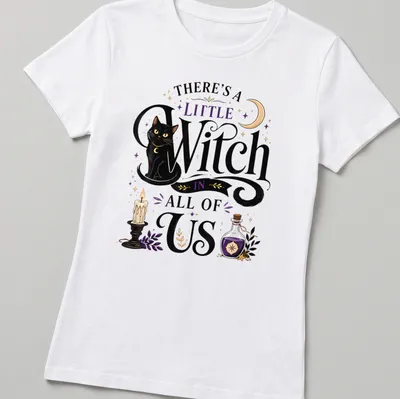 Whimsical illustration of a black cat with text about witches in colorful accents — printed on a women's shirt