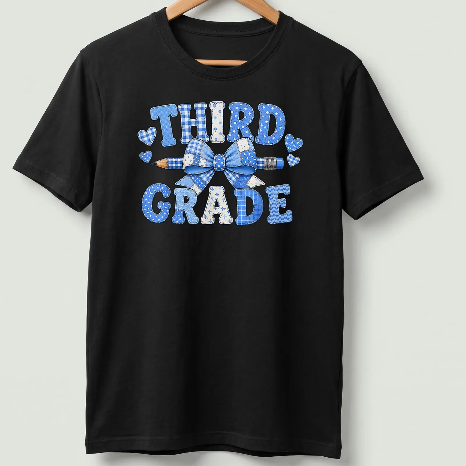 Patchwork design featuring 'THIRD GRADE', a blue bow, and a pencil. — printed on a unisex t-shirt