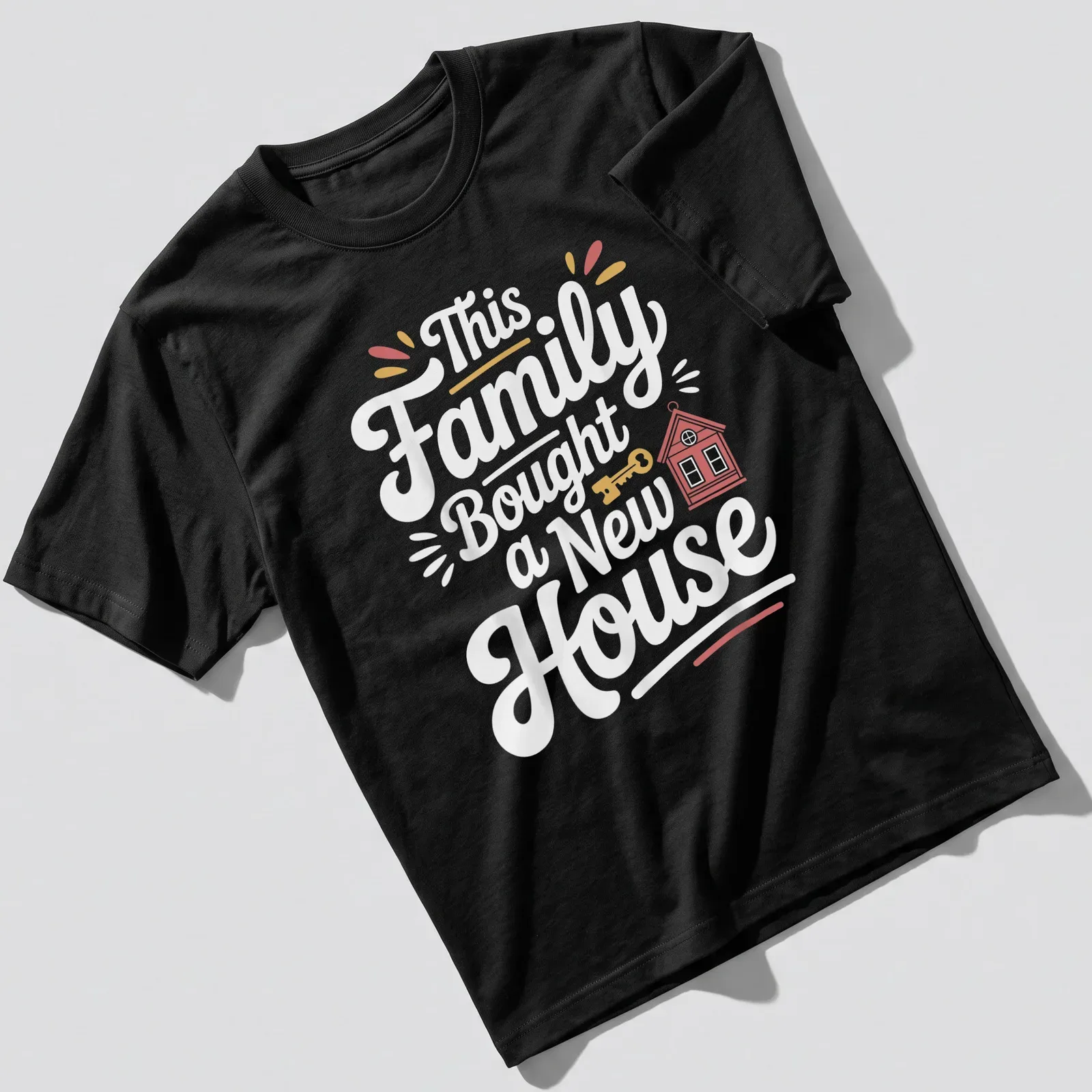 Playful design featuring a house and key with text about a family buying a new home — printed on a unisex t-shirt