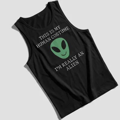 Playful t-shirt featuring a green alien face and humorous text about human costumes. — printed on a tank top
