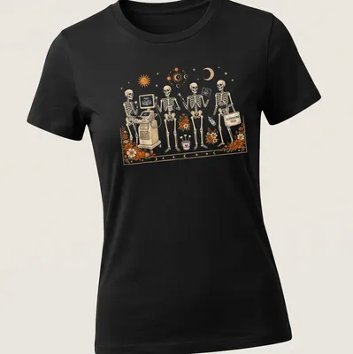 Whimsical illustration of skeletons with ultrasound equipment and text — printed on a women's shirt