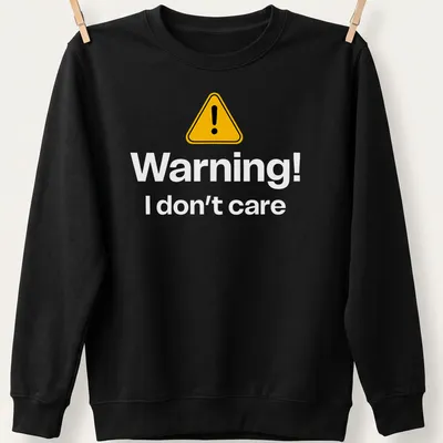 Warning sign graphic tee featuring bold text in yellow, black, and white — printed on a unisex sweatshirt