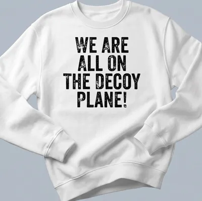Vintage political humor shirt with text: WE ARE ALL ON THE DECoy PLANE! — printed on a unisex sweatshirt