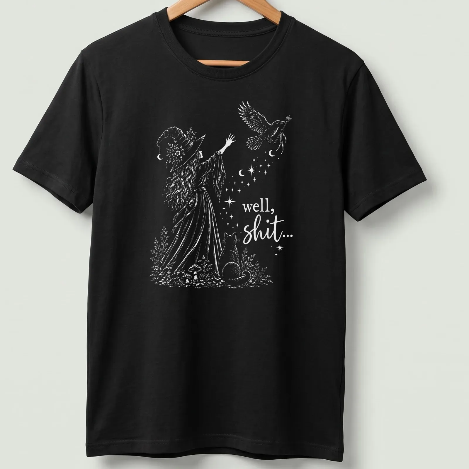 Whimsical illustration of a witch with cat and bird, featuring humorous text — printed on a unisex t-shirt