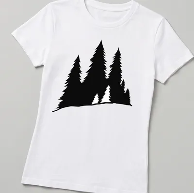 Silhouette design of pine trees in black on a white — printed on a women's shirt