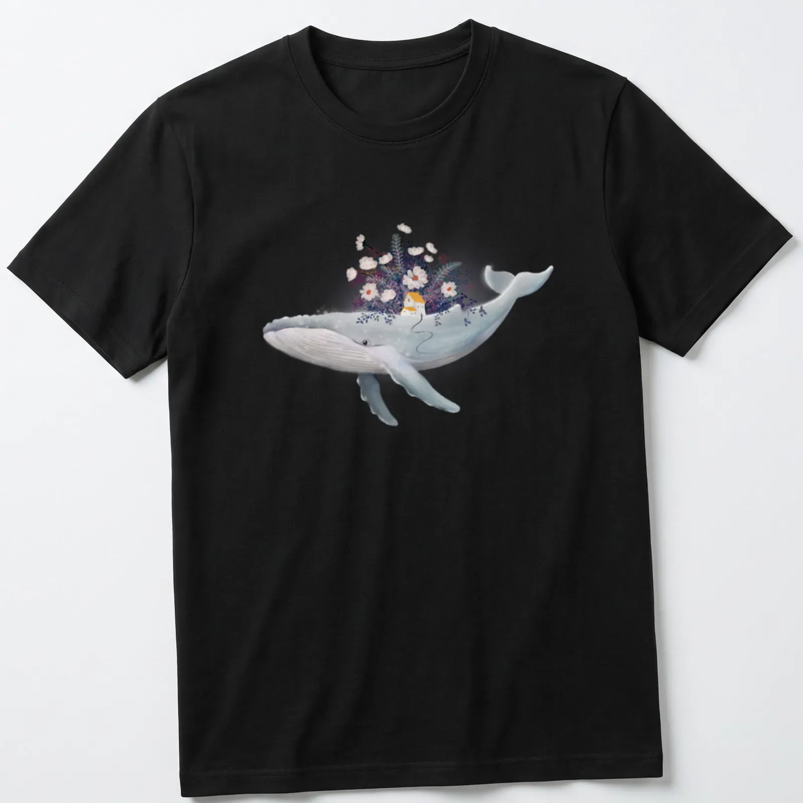 Watercolor design of a whale near a cottage garden in blue, white, yellow, purple, and pink — printed on a unisex t-shirt