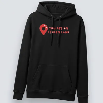 Bold text design on a shirt with a map pin graphic, red and white colors — printed on a unisex hoodie