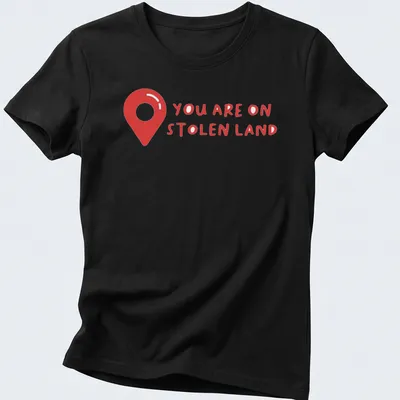 Bold text design on a shirt with a map pin graphic, red and white colors — printed on a women's shirt
